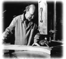 Reg Hall sawing a back-foot from the plank